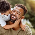 father-bonding-child-hug-happy-998572132.jpg
