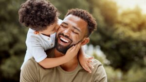 father-bonding-child-hug-happy-998572132.jpg
