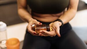 fit-woman-taking-supplements-hard-1007276146.jpg