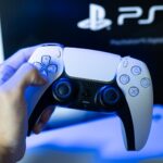 gamer-playing-playstation-5-game-834465574.jpg