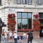 people-visit-wetherspoons-pub-london-799488034.jpg